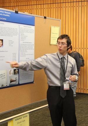Honor student presenting poster