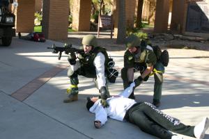 A student pretends to have been shot during the drill