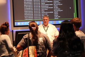 EMCC Instructional Computing faculty, Larry Heinz, explains cybersecurity to high school students.
